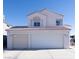 Two-story house with a two-car garage and landscaped yard at 1429 Daybreak Dr, Las Vegas, NV 89108