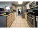 Galley-style kitchen with stainless steel appliances at 1429 Daybreak Dr, Las Vegas, NV 89108