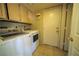 Laundry room with washer, dryer, and cabinets at 1429 Daybreak Dr, Las Vegas, NV 89108