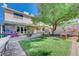 Landscaped backyard with patio and tree at 1510 Marita Dr, Boulder City, NV 89005