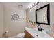 Updated bathroom with a modern vanity and nautical-themed decor at 1510 Marita Dr, Boulder City, NV 89005