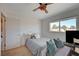 Bedroom with ceiling fan, window seat and large bed at 1510 Marita Dr, Boulder City, NV 89005