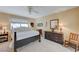 Bedroom with ceiling fan, dresser, and a rocking chair at 1510 Marita Dr, Boulder City, NV 89005