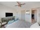 Bedroom with ceiling fan, TV, and a sitting area at 1510 Marita Dr, Boulder City, NV 89005