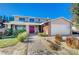 Two-story house with red door, brick accents, and landscaped yard at 1510 Marita Dr, Boulder City, NV 89005