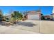 Two-story house with attached garage and driveway at 1510 Marita Dr, Boulder City, NV 89005