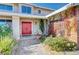 Front entry with red door, brick wall, and walkway at 1510 Marita Dr, Boulder City, NV 89005