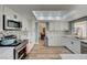 Modern kitchen features stainless steel appliances and white shaker cabinets at 1510 Marita Dr, Boulder City, NV 89005