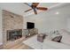 Cozy living room with brick fireplace and comfortable seating at 1510 Marita Dr, Boulder City, NV 89005