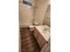 Clean bathroom with tub, toilet and wood-look floors at 1529 Tillman Falls Ave, Las Vegas, NV 89183