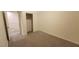 Well-lit bedroom with carpet, closet, and staircase view at 1529 Tillman Falls Ave, Las Vegas, NV 89183