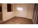 Dining area with wood-look flooring and a sliding door at 1529 Tillman Falls Ave, Las Vegas, NV 89183