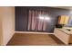 Dining room with wood-look flooring and purple curtains at 1529 Tillman Falls Ave, Las Vegas, NV 89183