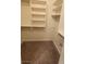 Large walk-in closet with shelving and neutral carpet at 1529 Tillman Falls Ave, Las Vegas, NV 89183