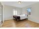 Bright bedroom with a double bed and wood-look flooring at 1641 Stewart Ave, Las Vegas, NV 89101