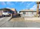 Front view of a house with carport and chain link fence at 1641 Stewart Ave, Las Vegas, NV 89101