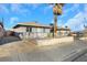 Street view of a single story house with a palm tree at 1641 Stewart Ave, Las Vegas, NV 89101