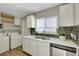 Bright kitchen with white cabinets, stainless steel appliances, and quartz countertops at 1641 Stewart Ave, Las Vegas, NV 89101