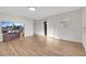 Living room with wood-look floors and large TV at 1641 Stewart Ave, Las Vegas, NV 89101