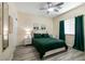 Cozy bedroom with a full bed, modern decor and a ceiling fan at 1642 Dire Wolf Ave, North Las Vegas, NV 89084