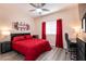 Spacious bedroom with a comfortable bed, and a home office at 1642 Dire Wolf Ave, North Las Vegas, NV 89084