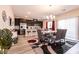 Bright dining area with a modern table and chairs, adjacent to the kitchen at 1642 Dire Wolf Ave, North Las Vegas, NV 89084