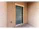 Dark teal front door with a keypad entry at 1642 Dire Wolf Ave, North Las Vegas, NV 89084