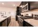 Modern kitchen with stainless steel appliances and ample counter space at 1642 Dire Wolf Ave, North Las Vegas, NV 89084