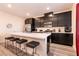 Modern kitchen with stainless steel appliances and an island with seating at 1642 Dire Wolf Ave, North Las Vegas, NV 89084