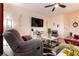 Living room with grey sectional sofa and a view of the kitchen at 1642 Dire Wolf Ave, North Las Vegas, NV 89084