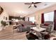 Open living room featuring hardwood floors, comfortable seating, and a view of the kitchen at 1642 Dire Wolf Ave, North Las Vegas, NV 89084