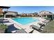 Community pool with lounge chairs and shaded seating at 1642 Dire Wolf Ave, North Las Vegas, NV 89084