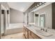 Bathroom boasts double vanity and soaking tub at 1901 Summit Pointe Dr, Las Vegas, NV 89117