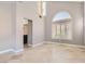 Bright living room with large windows and tile floors at 1901 Summit Pointe Dr, Las Vegas, NV 89117