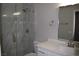 Modern bathroom with marble shower and vanity at 1908 Quail Point Ct, Las Vegas, NV 89117