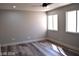 Bright bedroom with wood-look floors and multiple windows at 1908 Quail Point Ct, Las Vegas, NV 89117