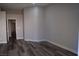 Simple bedroom with hardwood floors and neutral walls at 1908 Quail Point Ct, Las Vegas, NV 89117