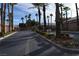 Gated entrance to a community with palm trees at 1908 Quail Point Ct, Las Vegas, NV 89117