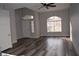 Bright living room with hardwood floors and large windows at 1908 Quail Point Ct, Las Vegas, NV 89117