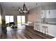 Open concept living room with hardwood floors and modern furniture at 1908 Quail Point Ct, Las Vegas, NV 89117