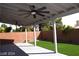 Covered patio with ceiling fan and artificial turf at 1908 Quail Point Ct, Las Vegas, NV 89117