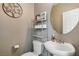 Small bathroom with toilet, sink, and storage at 1937 Shanon Michelle Ave, North Las Vegas, NV 89031