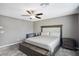 Primary bedroom with king bed, ceiling fan, and ensuite bath at 1937 Shanon Michelle Ave, North Las Vegas, NV 89031