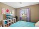 Bright bedroom with a comfortable bed, TV, and ample storage at 1937 Shanon Michelle Ave, North Las Vegas, NV 89031