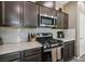 Stainless steel appliances and modern cabinetry in kitchen at 1937 Shanon Michelle Ave, North Las Vegas, NV 89031