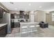 Modern kitchen with dark brown cabinets, stainless steel appliances, and an island at 1937 Shanon Michelle Ave, North Las Vegas, NV 89031