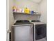 Laundry room with washer, dryer, and shelving at 1937 Shanon Michelle Ave, North Las Vegas, NV 89031