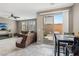 Living room with sectional sofa and view of backyard through sliding doors at 1937 Shanon Michelle Ave, North Las Vegas, NV 89031