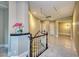 Stunning marble floors and curved staircase in the foyer at 2 Cerchio Centrale, Henderson, NV 89011