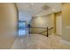 Elegant marble flooring and a curved staircase in the hallway at 2 Cerchio Centrale, Henderson, NV 89011